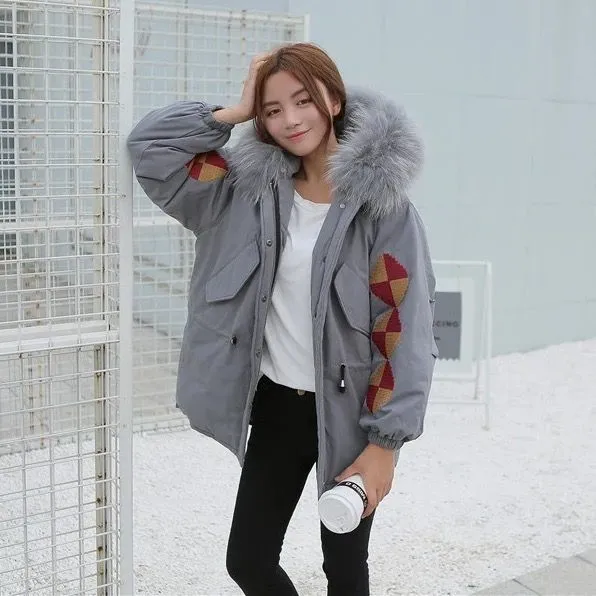 Winter coat for women with geometric embroidery and fur hood